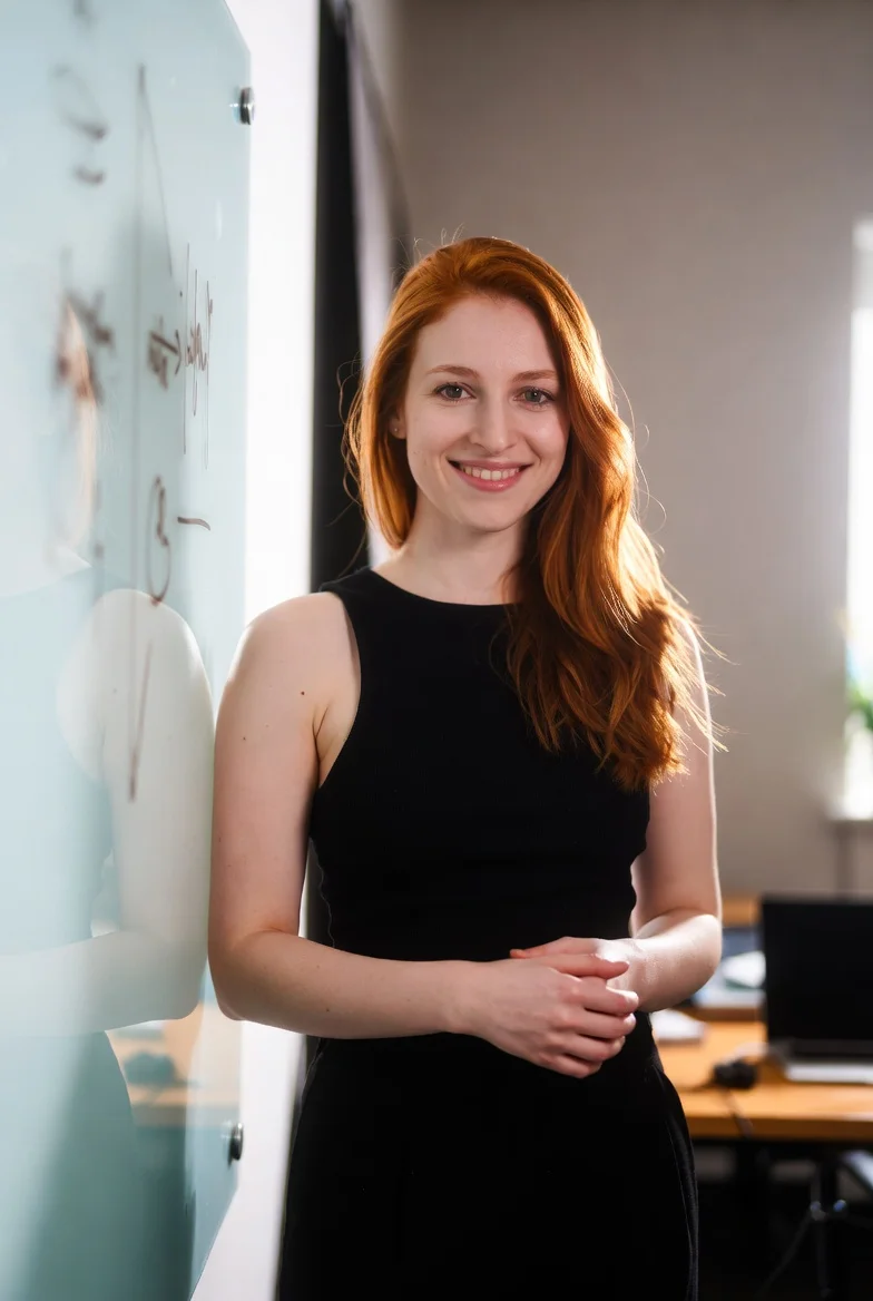 Woman presenting at whiteboard
